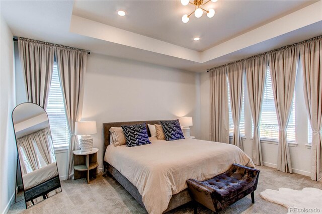 bedroom featuring light carpet, baseboards, and recessed lighting