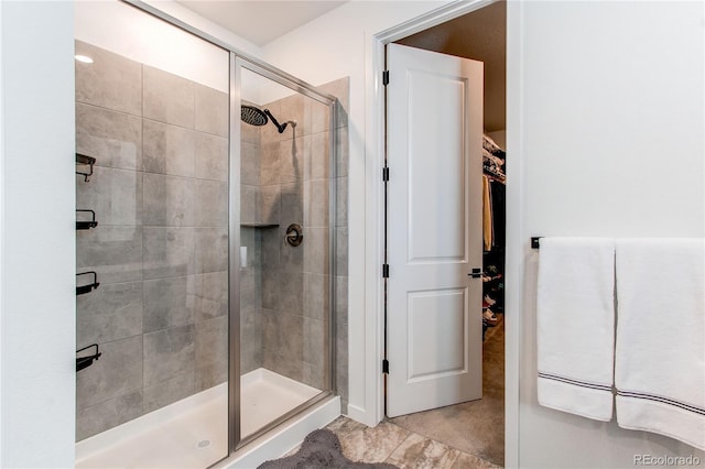 bathroom with a shower stall