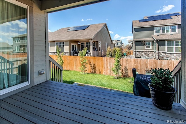 deck with fence and a residential view