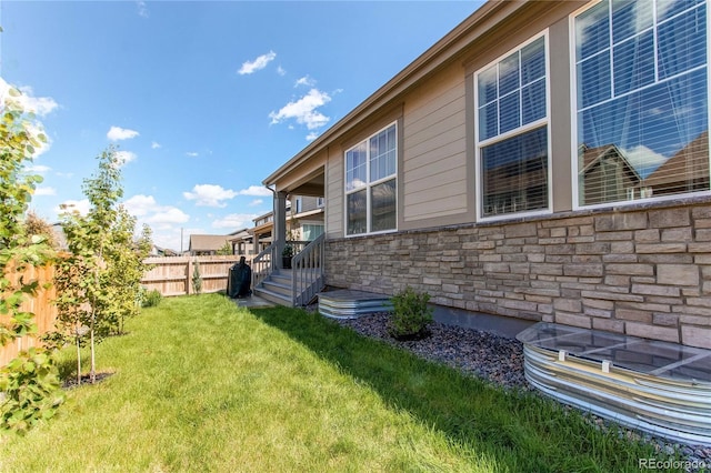 view of home's exterior with stone siding