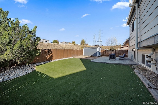 view of yard featuring a patio and a shed