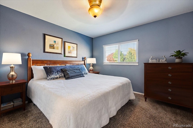 bedroom with dark carpet and ceiling fan