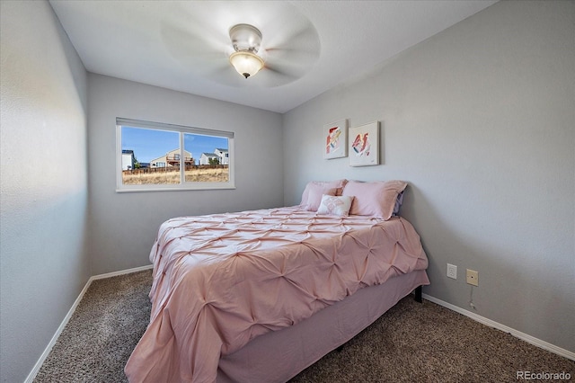 bedroom with dark colored carpet and ceiling fan