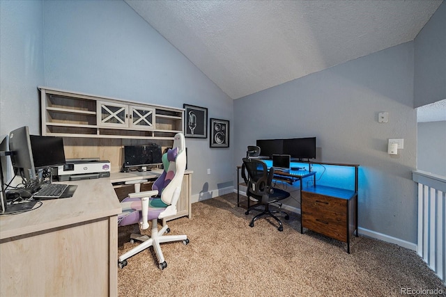 office space featuring vaulted ceiling, carpet flooring, and a textured ceiling