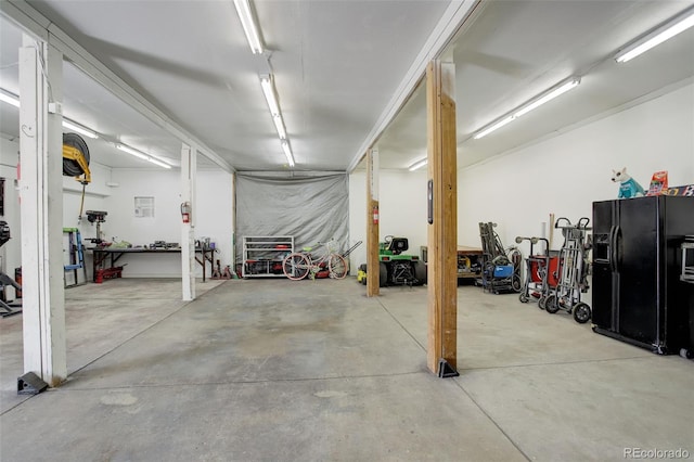 garage featuring black fridge