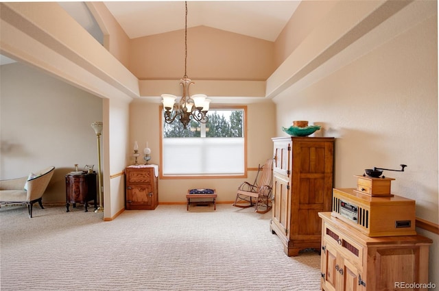 living area with a chandelier, light colored carpet, vaulted ceiling, and baseboards