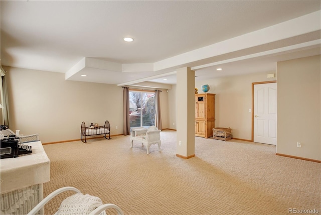 living area with recessed lighting, baseboards, and carpet