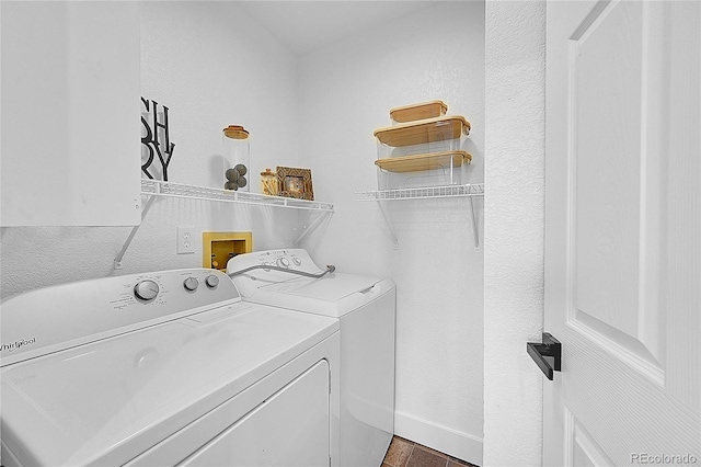 clothes washing area featuring dark hardwood / wood-style floors and washing machine and clothes dryer