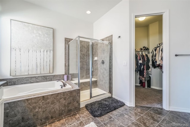 bathroom featuring separate shower and tub