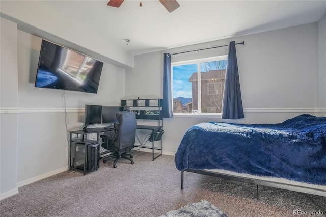 bedroom with ceiling fan and carpet floors