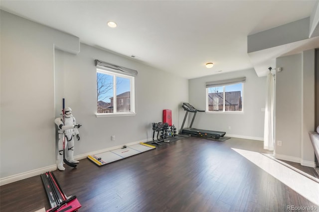 workout room featuring dark wood-type flooring