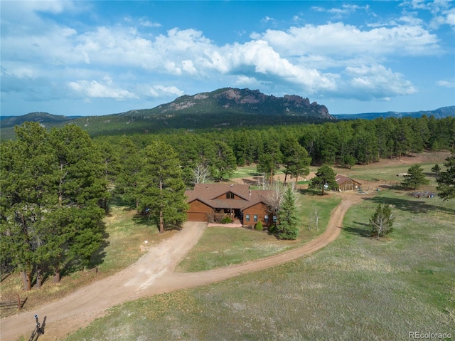aerial view with a forest view and a mountain view