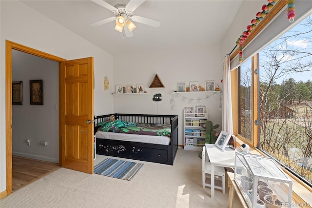 carpeted bedroom with ceiling fan, lofted ceiling, access to outside, and baseboards