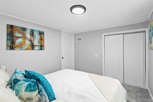 carpeted bedroom with a closet