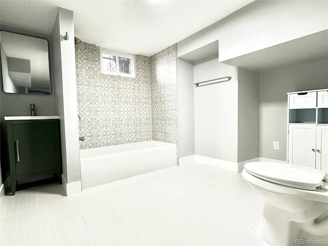 full bathroom with tile patterned flooring, vanity, shower / washtub combination, and toilet