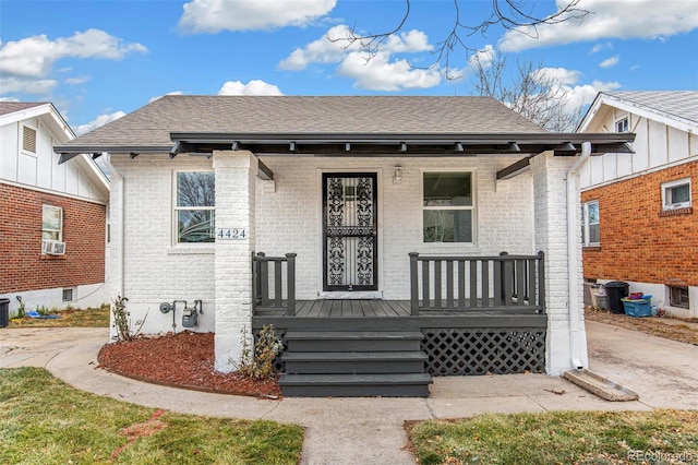 view of front facade with cooling unit and covered porch