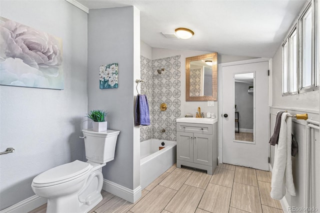 bathroom featuring vanity, vaulted ceiling, and toilet