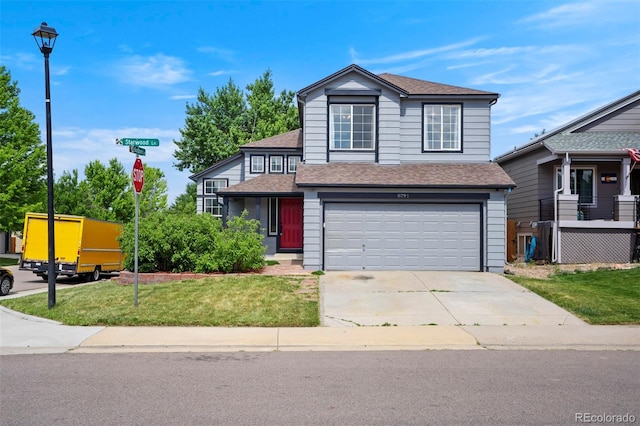 8791 Starwood Ln, Parker, CO 80134 - view of front of home featuring a shingled roof, a garage, driveway, and a front lawn