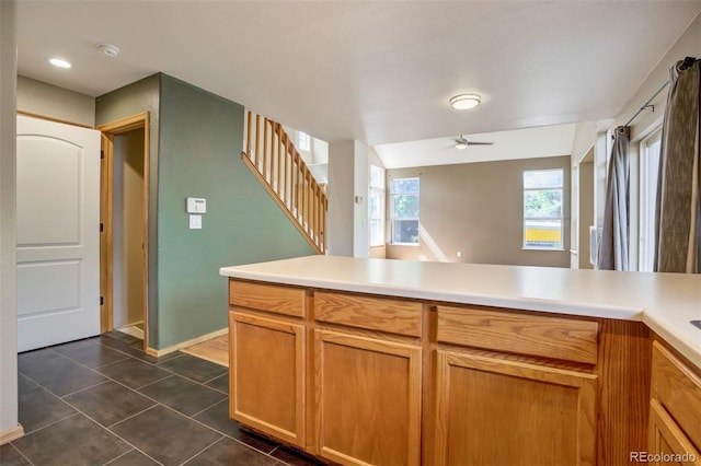 8791 Starwood Ln, Parker, CO 80134 - kitchen featuring ceiling fan, light countertops, and dark tile patterned flooring