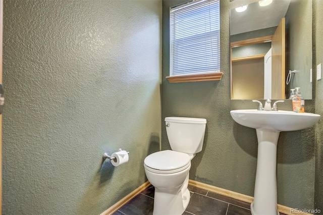 8791 Starwood Ln, Parker, CO 80134 - bathroom featuring toilet and tile patterned flooring