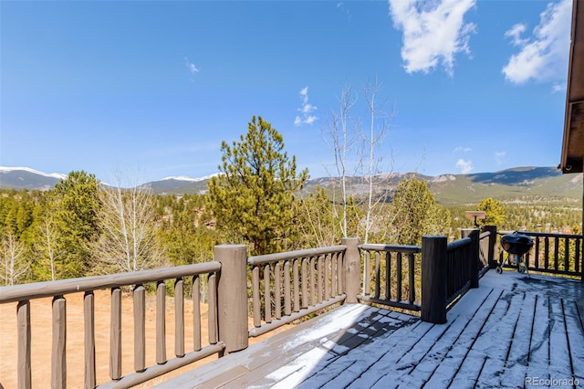 wooden deck with a mountain view
