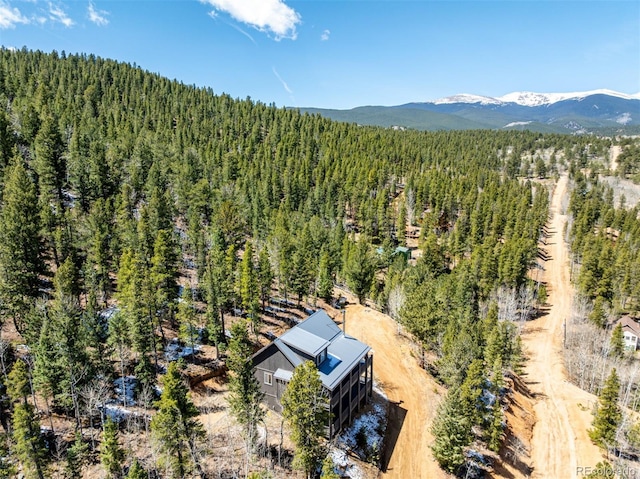 bird's eye view with a mountain view and a wooded view