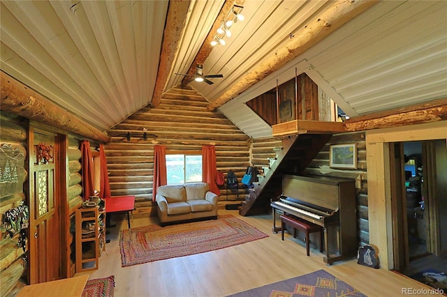 420 Quarzt Ln, Pitkin, CO 81241 - living room with rustic walls, wood finished floors, lofted ceiling, ceiling fan, and rail lighting