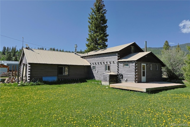 420 Quarzt Ln, Pitkin, CO 81241 - rear view of house with a wooden deck, a lawn, a metal roof, and log siding