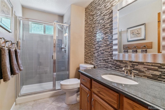 bathroom with toilet, a stall shower, tasteful backsplash, and tile patterned floors