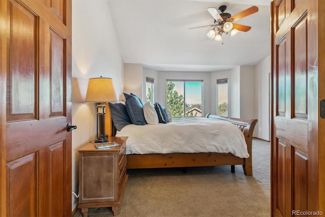 bedroom featuring a ceiling fan and light colored carpet