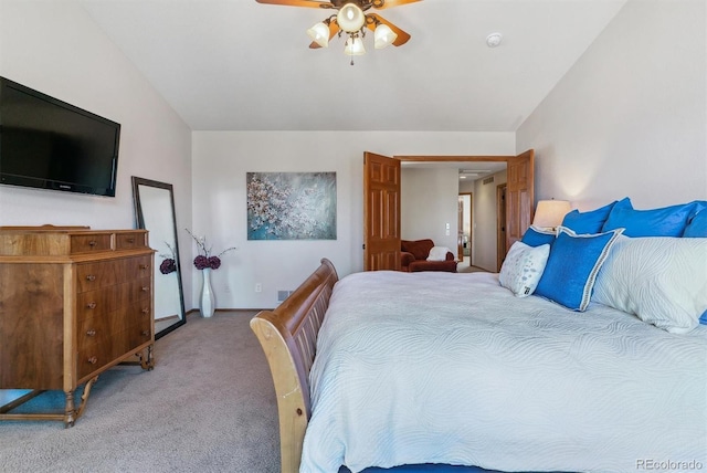 bedroom with light carpet, ceiling fan, and lofted ceiling