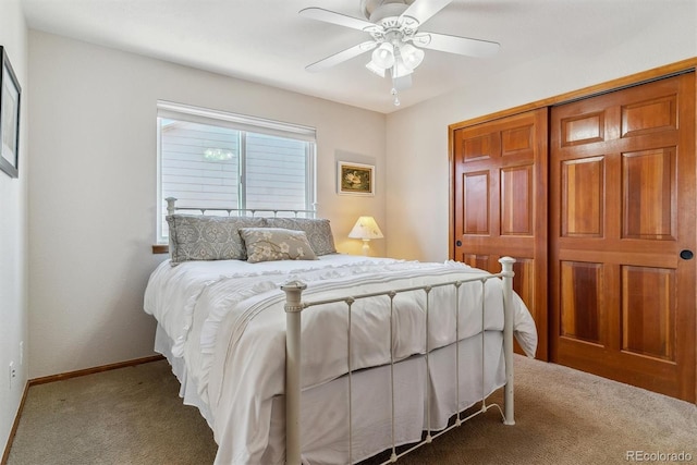 carpeted bedroom featuring ceiling fan and baseboards