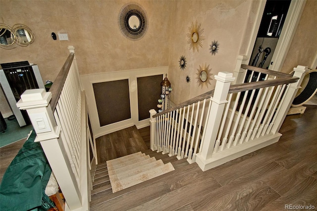 staircase featuring hardwood / wood-style flooring