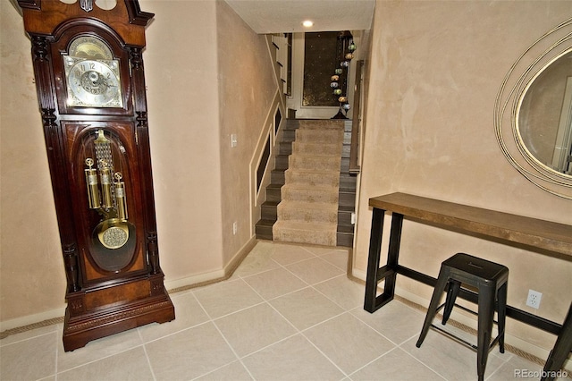 stairway featuring tile patterned floors