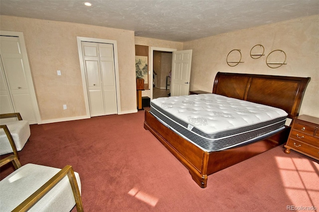 carpeted bedroom with a textured ceiling