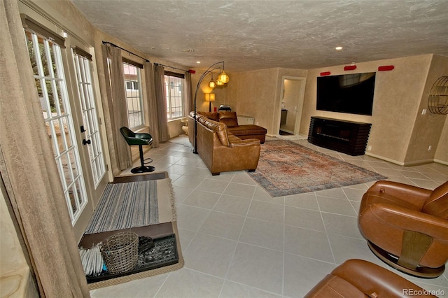 living room featuring a wealth of natural light and light tile patterned floors