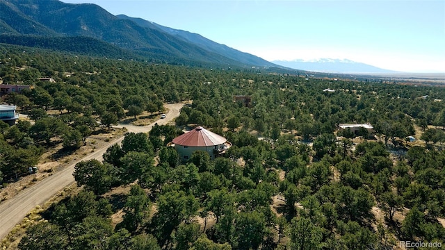 drone / aerial view featuring a mountain view