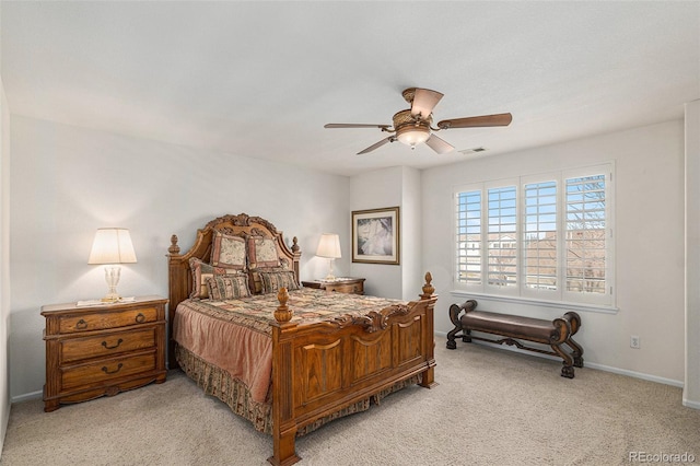 bedroom with light carpet and ceiling fan