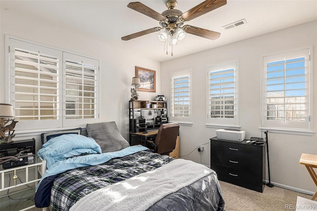 carpeted bedroom featuring ceiling fan