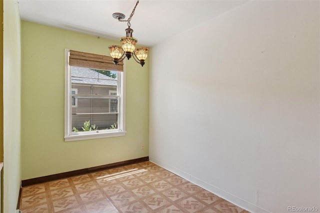 1832 S Saint Paul St, Denver, CO 80210 - unfurnished room with a chandelier and baseboards