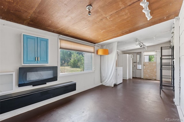 1832 S Saint Paul St, Denver, CO 80210 - unfurnished living room with concrete flooring and vaulted ceiling