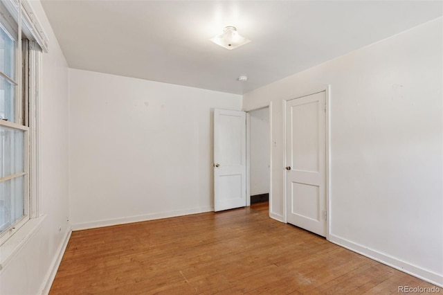 1832 S Saint Paul St, Denver, CO 80210 - spare room featuring light wood-style floors and baseboards