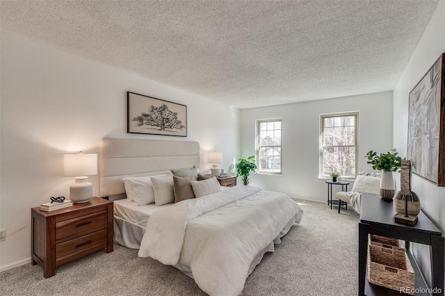 bedroom featuring light carpet, baseboards, and a textured ceiling