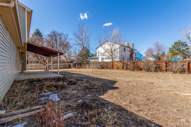 view of yard featuring a patio area and a fenced backyard