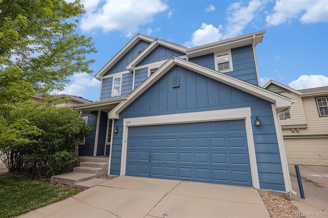 3289 Cummings Dr, Erie, CO 80516 - view of front of property featuring board and batten siding, driveway, and an attached garage