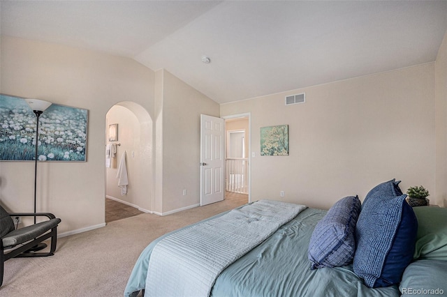 3289 Cummings Dr, Erie, CO 80516 - bedroom with arched walkways, carpet flooring, and lofted ceiling