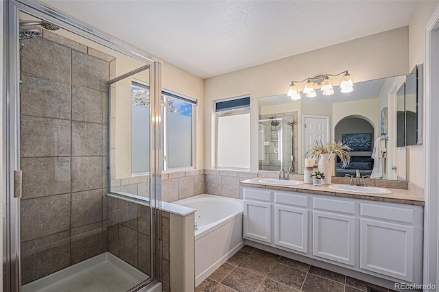 3289 Cummings Dr, Erie, CO 80516 - ensuite bathroom featuring a stall shower, a bath, and double vanity