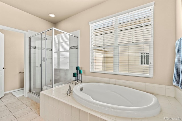 17956 Gypsum Canyon Ct, Monument, CO 80132 - full bathroom with a bath, a shower stall, plenty of natural light, and tile patterned floors