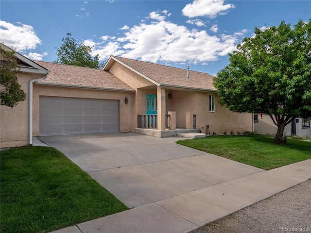 1436 H St Unit D, Salida, CO 81201 - ranch-style house featuring stucco siding, concrete driveway, a garage, and a front lawn