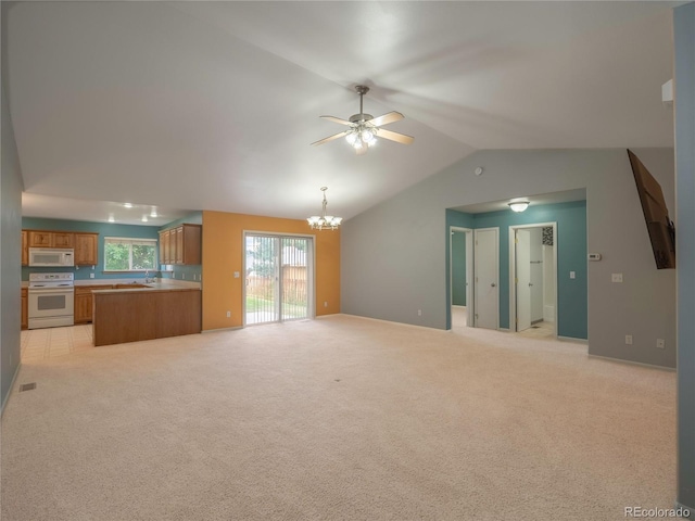 1436 H St Unit D, Salida, CO 81201 - unfurnished living room with a chandelier, vaulted ceiling, a ceiling fan, and light colored carpet